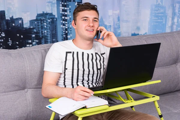 Young handsome man working from home — Stock Photo, Image