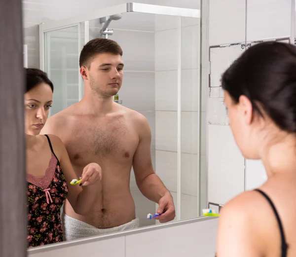 Young couple are going to brush their teeth — Stok fotoğraf