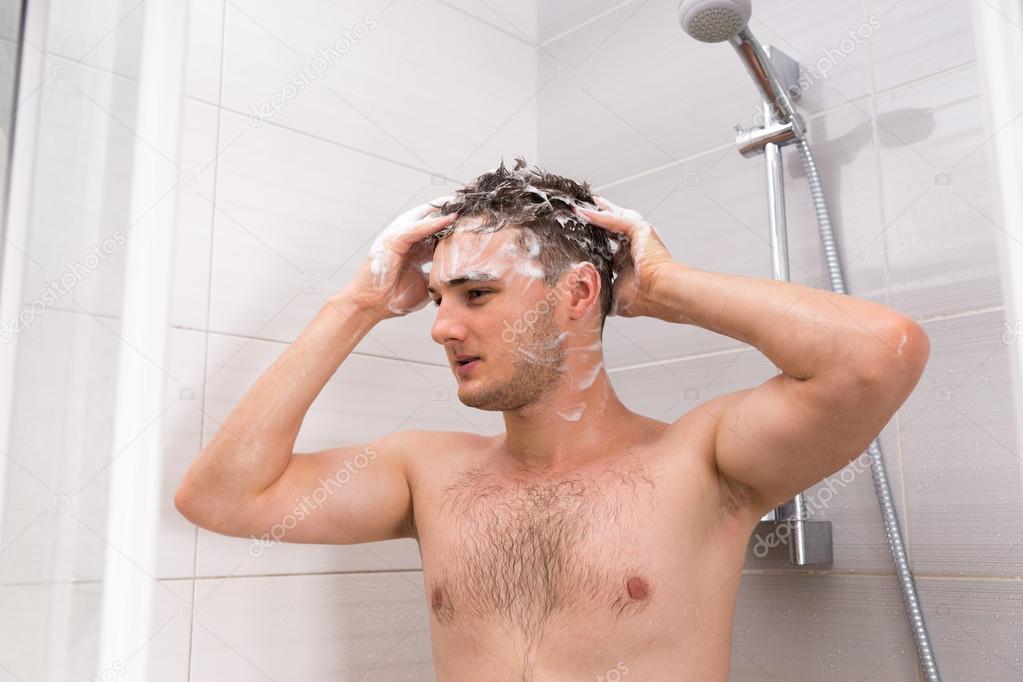 Handsome male washing his hair with both hands Stock Photo by ©Vaicheslav  120389060