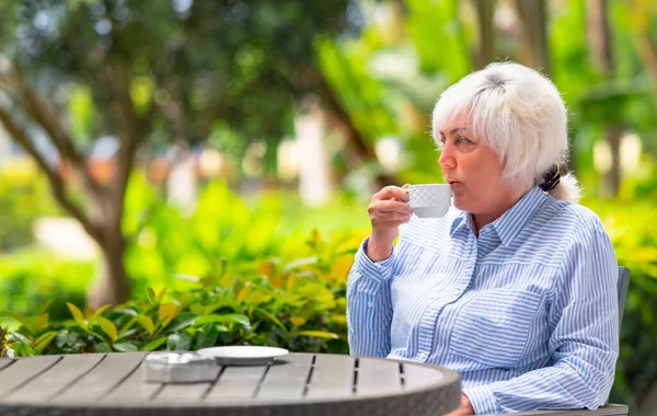 Thoughtful Woman Relaxing Cup Tea Coffee Outdoor Patio Lush Green — Stock Photo, Image