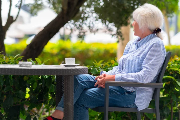 Pensive Woman Relaxing Outdoor Patio Restaurant Table Cup Tea She — Stock Photo, Image