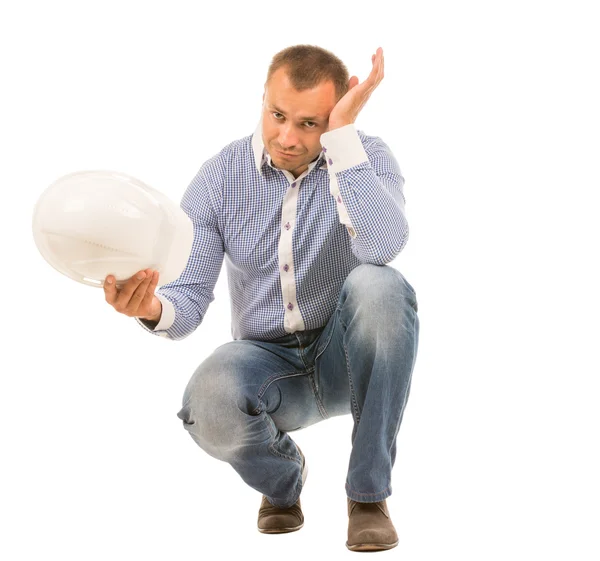 Crouching Man with Hard Hat Resting Head on Hand — Stock Photo, Image