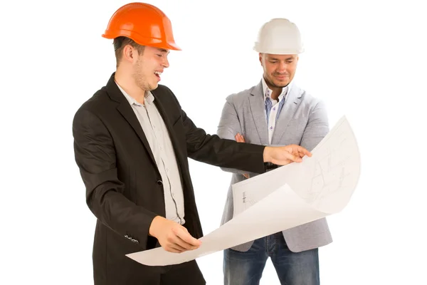 Architect holding a plan watched by his partner — Stock Photo, Image