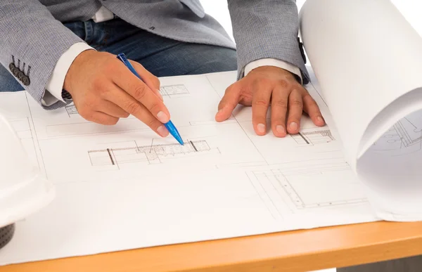 Architect or engineer checking a blueprint — Stock Photo, Image