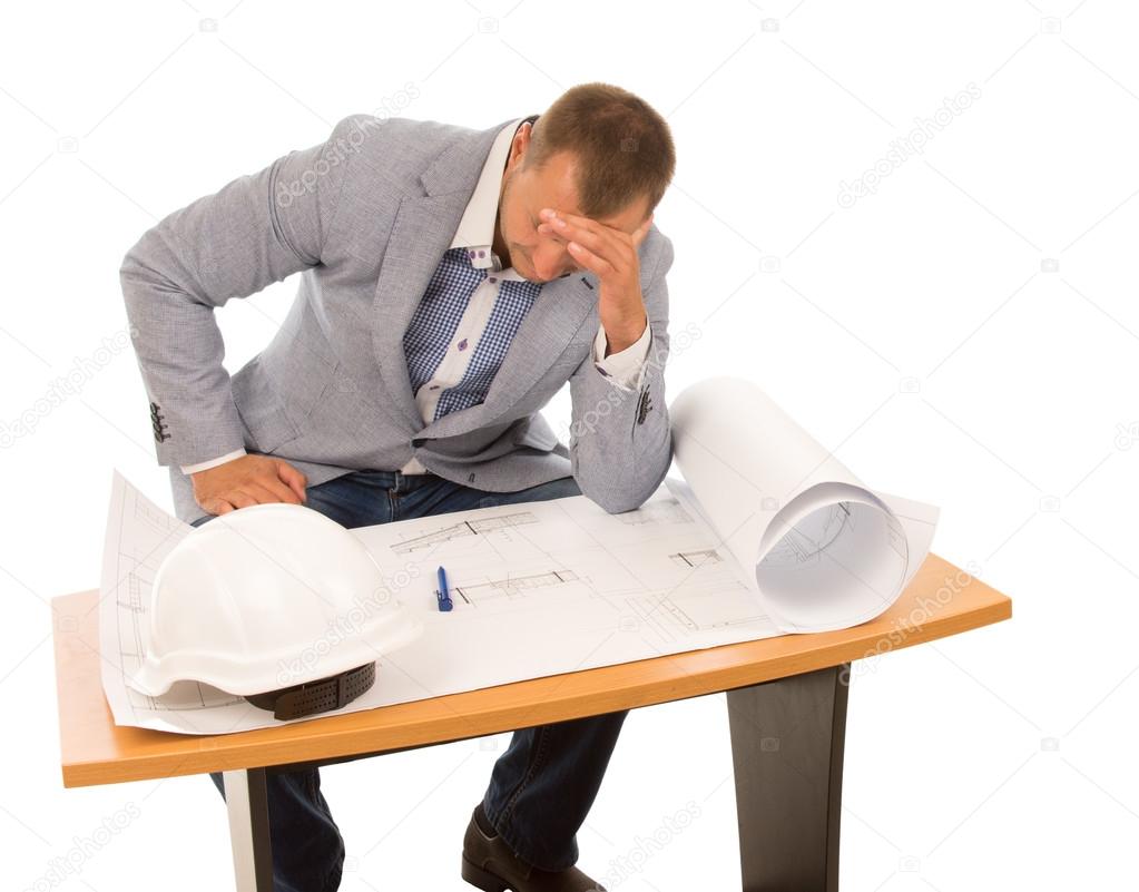 Architect or builder studying a blueprint