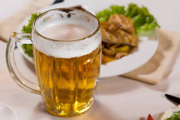 Close up Mug of Beer Beside Main Dish — Stock Photo, Image