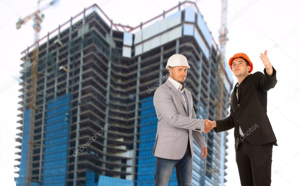Architect and structural engineer shaking hands
