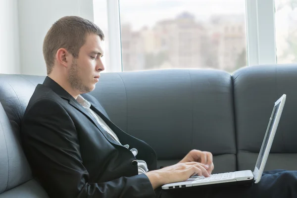 Handsome Executive Typing at Laptop Seriously — Stock Photo, Image