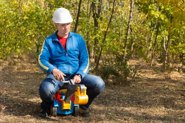 Middle Age Man Riding a Truck Toy — Stock Photo, Image