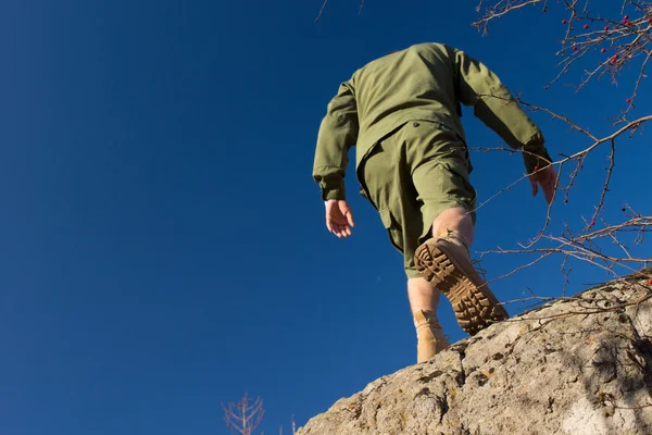 Young Male Scout Climbing on Old Rock — Stock Photo, Image
