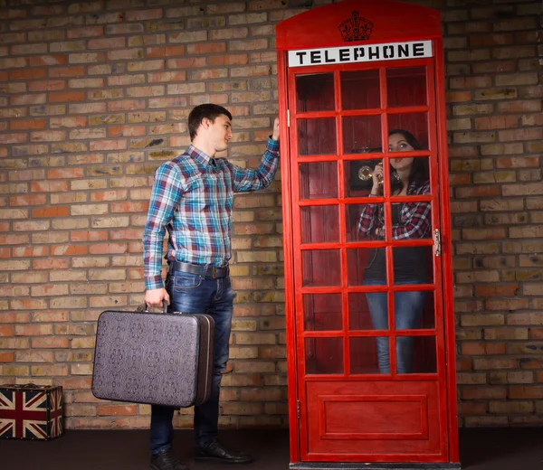 Man trying to attract his wifes attention — Stock Photo, Image