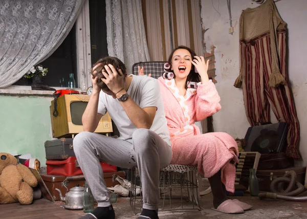 Couple in a squalid room having an argument — Stock Photo, Image