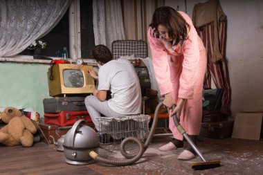 Young Couple Cleaning an Abandoned Room clipart