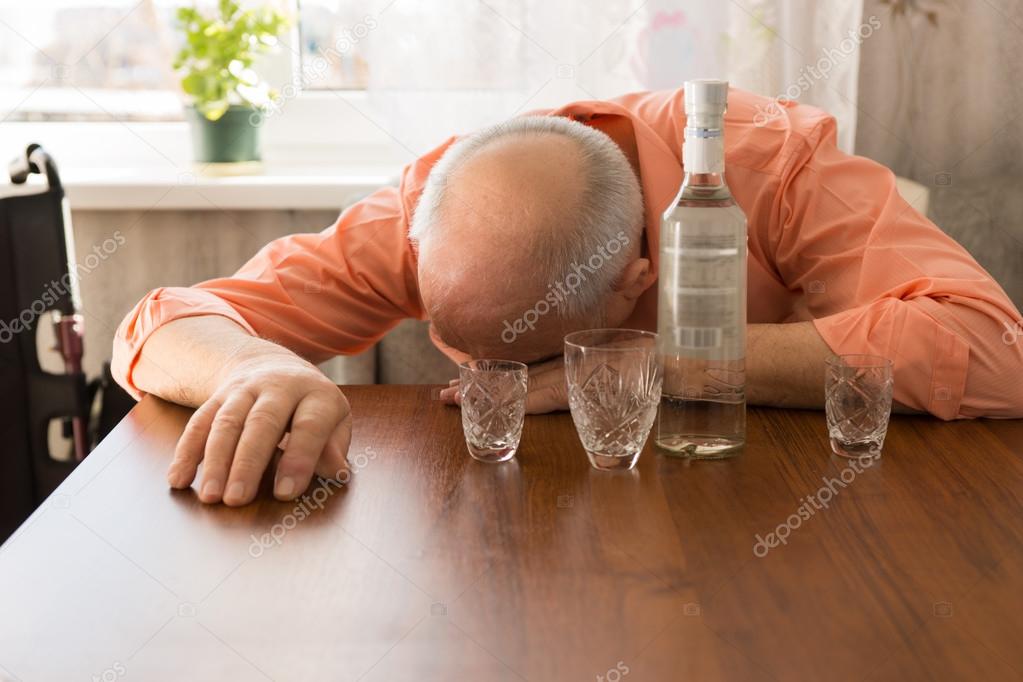 Drunk Bald Elderly Taking a Nap on the Table