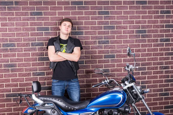 Confident Young Man Standing Behind his Motorbike — Stock Photo, Image