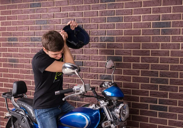 Young Man About to Beat his Motorbike with Helmet — Stock Photo, Image