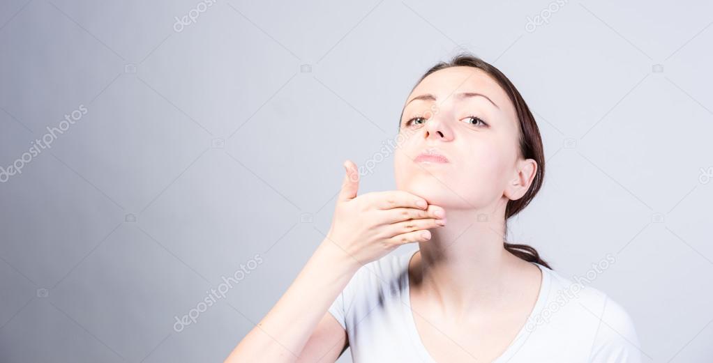 Woman Tilting her Head While Lifting her Chin