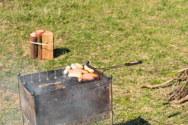 Plenty of Grilled Meat Sausages on Barbecue Grill — Stock Photo, Image