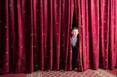 Excited little boy on stage clipart