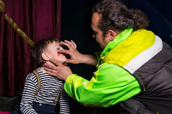 Man Applying Clown Make Up to Boys Face — Stok Foto