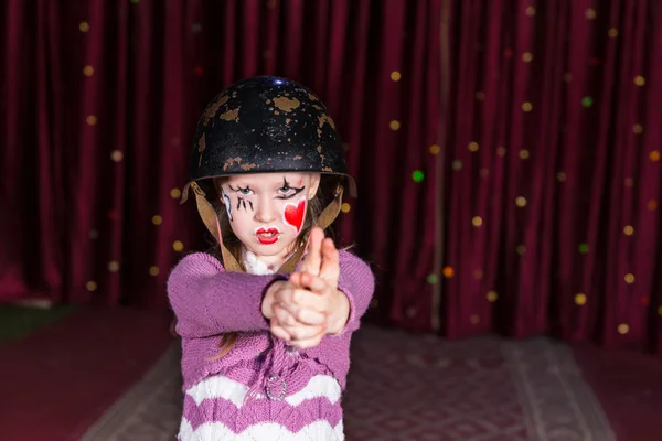 Girl Making Gun with Hands and Aiming at Camera — Stock Photo, Image