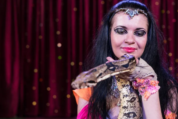 Exotic Snake Charmer Holding Large Snake on Stage — Stock Photo, Image