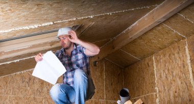 Builder Reading Plans Inside Unfinished Home clipart