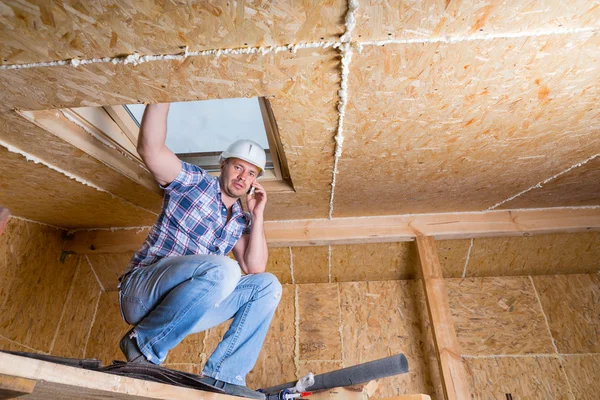 Builder on Cell Phone Inside Unfinished Home — Stock Photo, Image