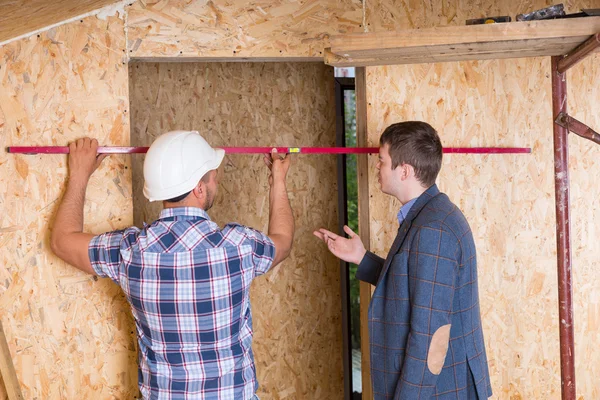 Builder and Architect Inspecting Door Frame — Stock Photo, Image