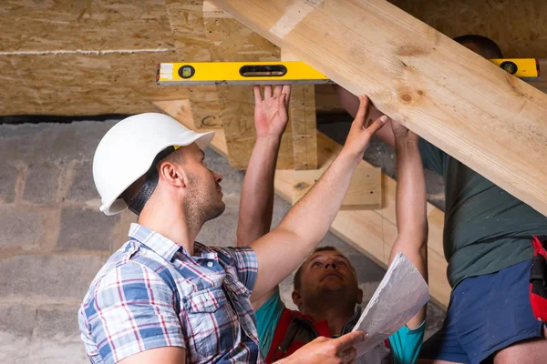 Team of Construction Workers Building Staircase Royalty Free Stock Photos