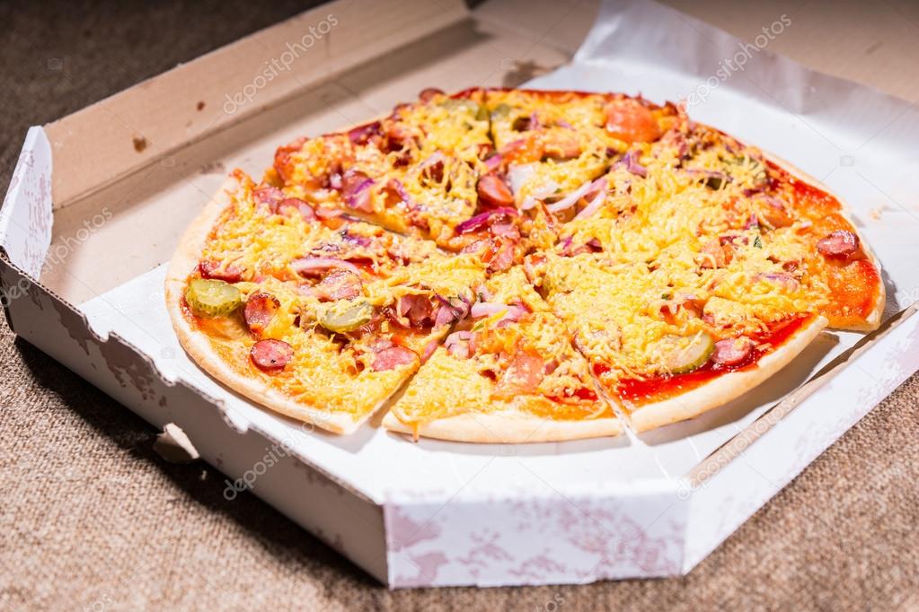 Artisan Pizza Topped with Cheese in Carboard Box