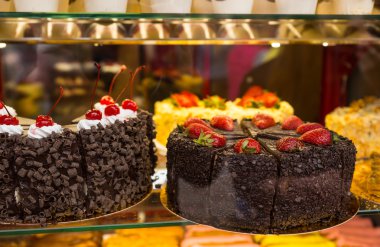 Selection of Decadent Cakes in Window Display