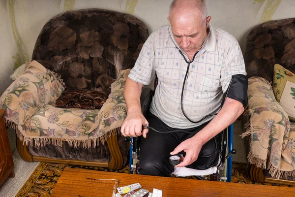 Elderly Man with Special Needs Checking his BP — Stock Photo, Image