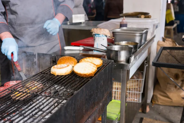 Cooking Burgers on Charcoal Grill in Restaurant — Stok fotoğraf