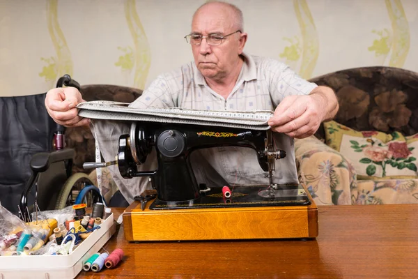 Senior Man Measuring Fabric on Sewing Machine — Stock Fotó