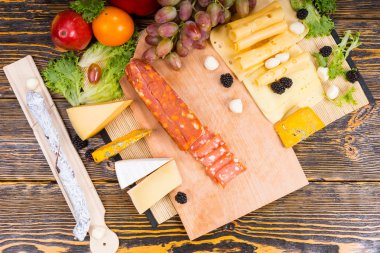 Gourmet Meat and Cheese Board on Wooden Table