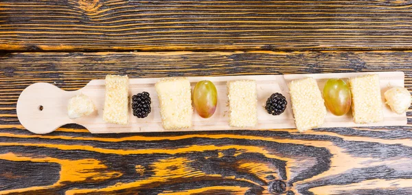 Long Board with Fresh Fruit and Cheese on Table — Stock Fotó