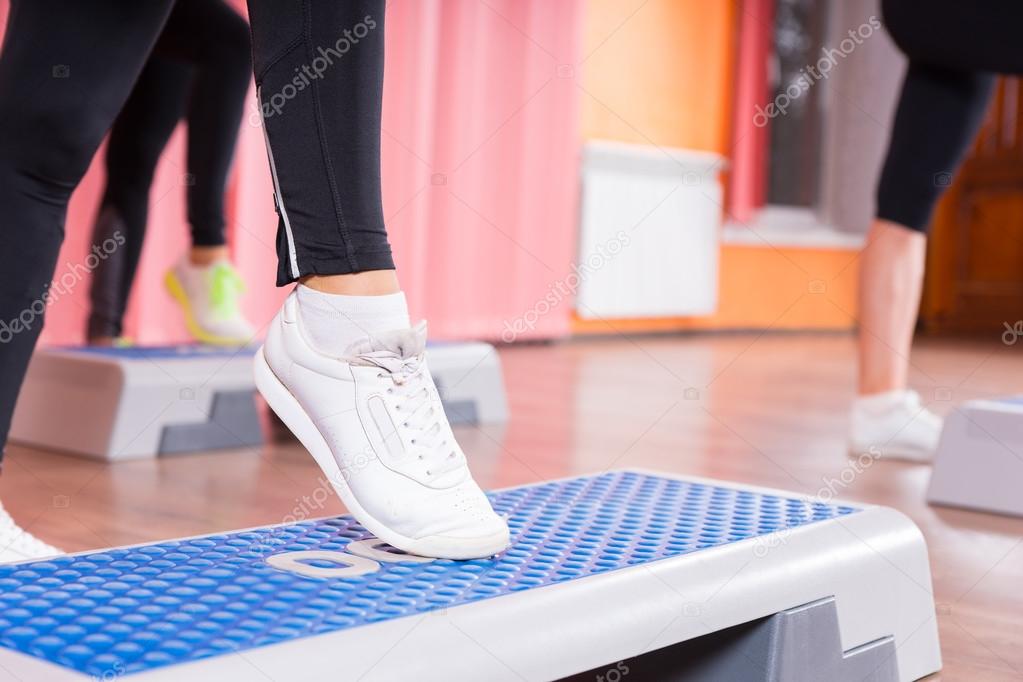 Close Up of Woman Wearing Sneakers in Step Class