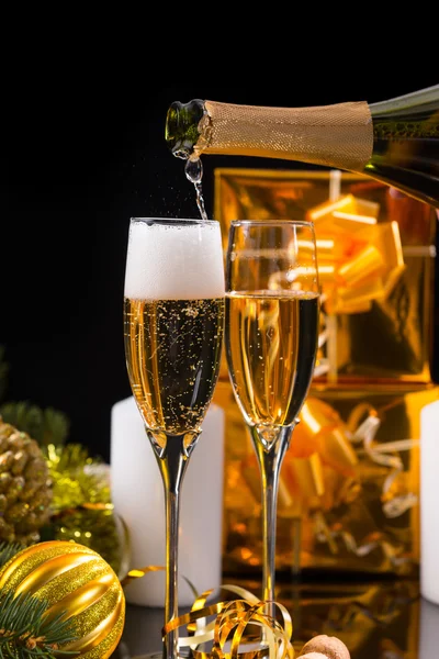 Pouring Festive Champagne into Pair of Flutes — Stok fotoğraf