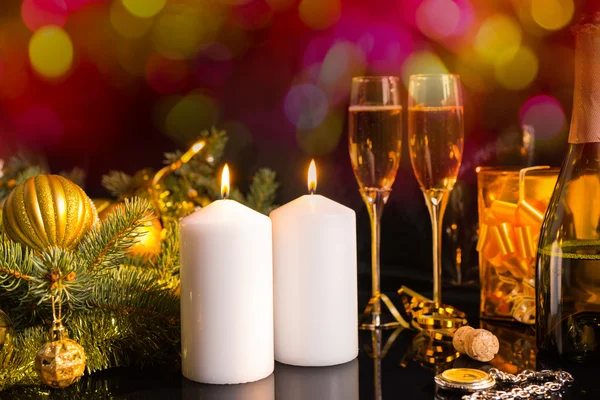Lit Candles and Champagne in Festive Still Life — Stok fotoğraf