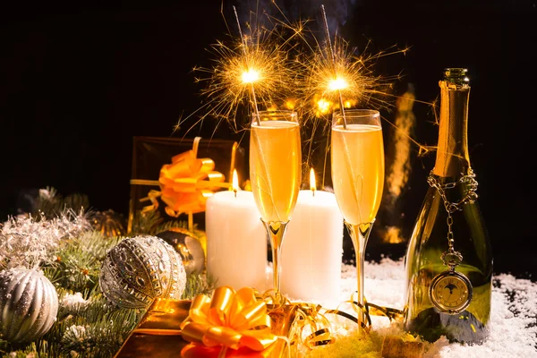 Celebrating with sparklers and champagne — Stock Photo, Image