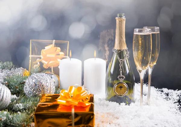 Champagne, Candles and Gifts in Festive Still Life — Stock Photo, Image