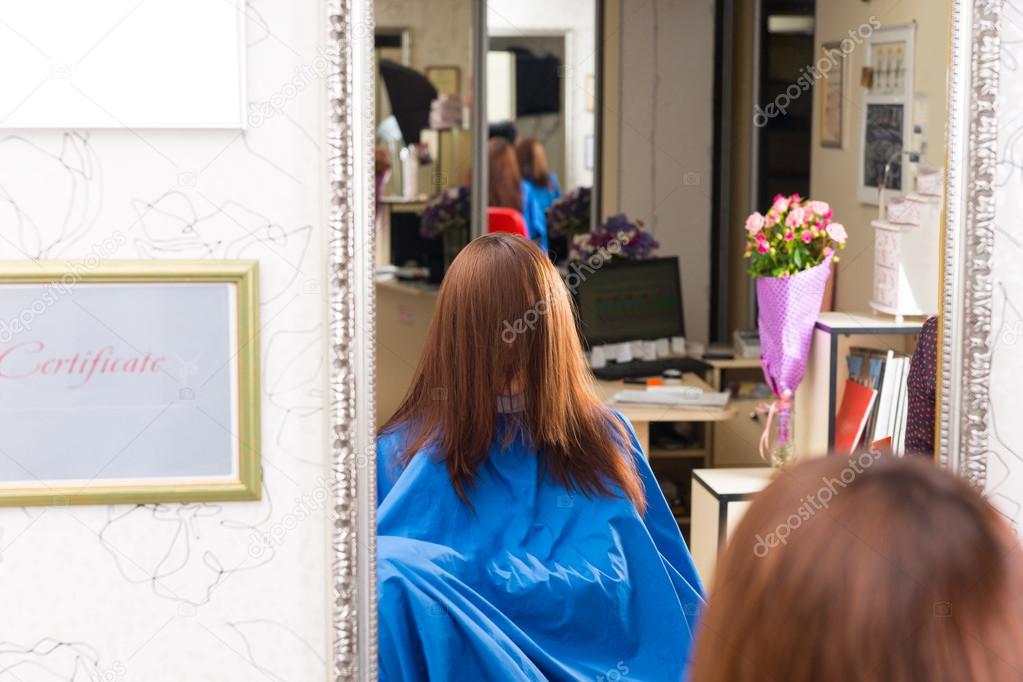 Woman in Salon with Hair Covering Face