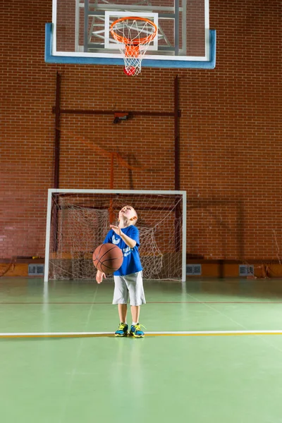 Young boy practicing his shooting at goal — Stock Photo, Image