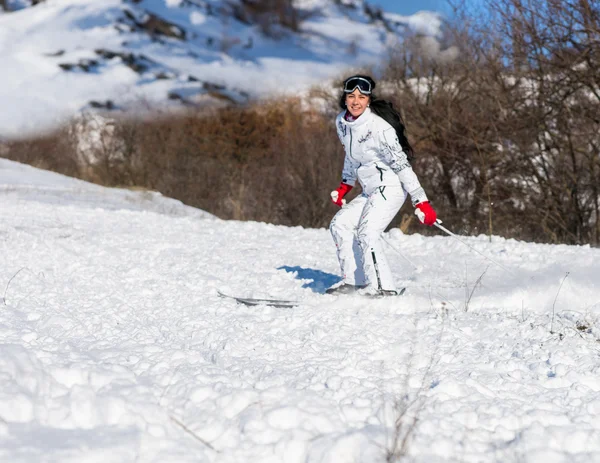 Happy Woman Skiing on Slope in Bright Sunshine — 图库照片