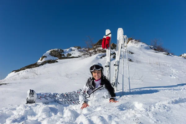 Female Skier Taking a Break on Snowy Mountainside — Stok fotoğraf
