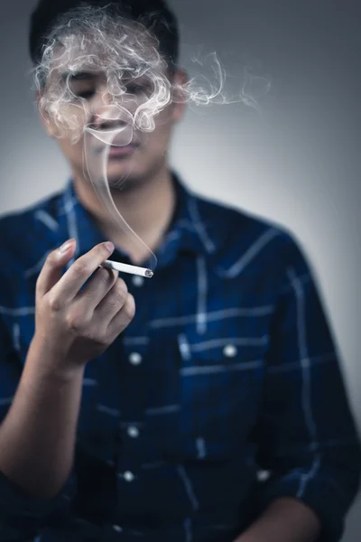 Teenager boy smoking — Stock Photo, Image