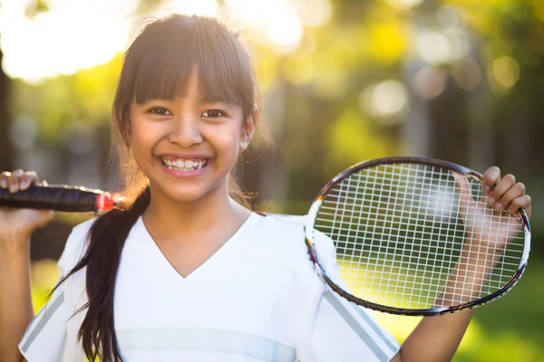 Little asian girl holding a badminton racket — Stock Photo, Image