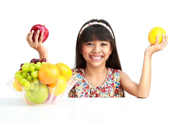 Little asian girl with fruit — Stock Photo, Image