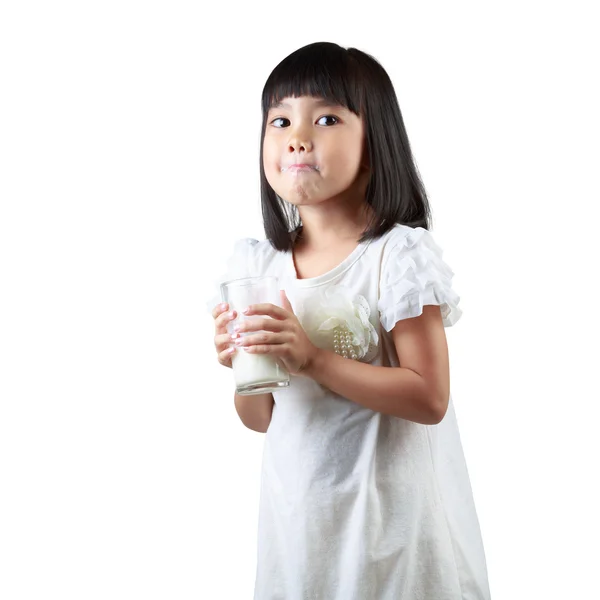 Happy little Asian girl holding a cup of milk — Stock Photo, Image